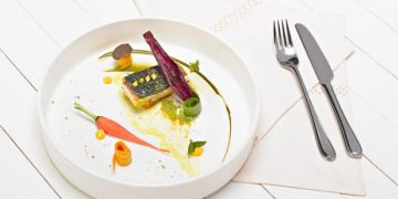 Grilled sturgeon with pandan leaves with turmeric sauce