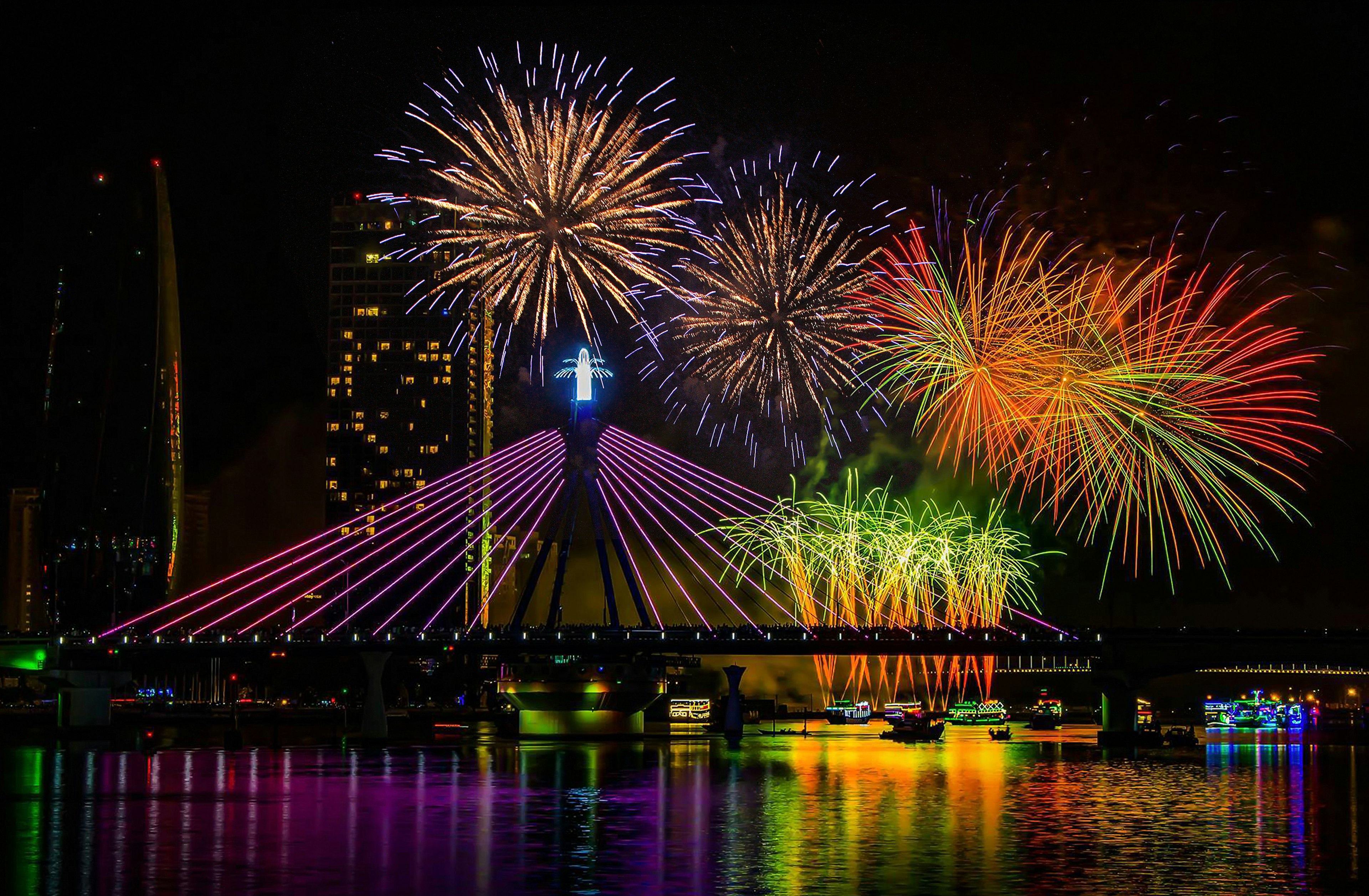 Colorful fireworks light up the night sky over the Han River in Danang, Vietnam.